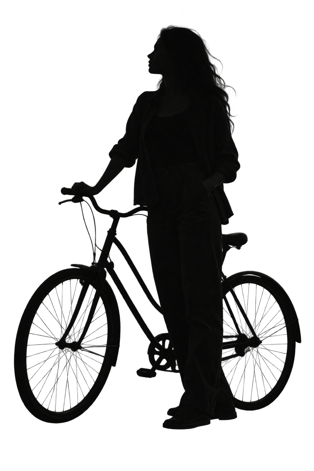 A young adult beside a bicycle, looking towards the distance.